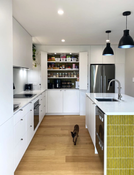 Kitchen with pantry doors open